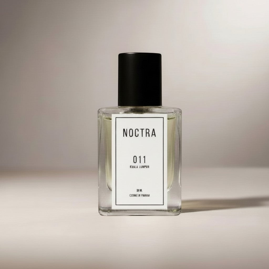 NOCTRASCENTSH NOCTRA 011 clear glass perfume bottle with black cap, featuring a white label with black text.