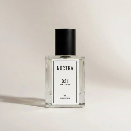 NOCTRASCENTSH 021 Kuala Lumpur extrait de parfum in a clear glass bottle with a black cap.