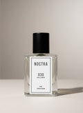 NOCTRASCENTS NOCTRA 030 Kuala Lumpur extrait de parfum in a clear glass bottle with a black cap.