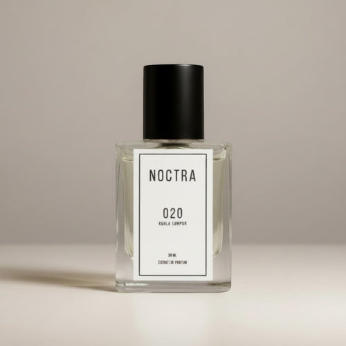 NOCTRASCENTSH NOCTRA 020 Kuala Lumpur extrait de parfum in a clear glass bottle with a black cap.
